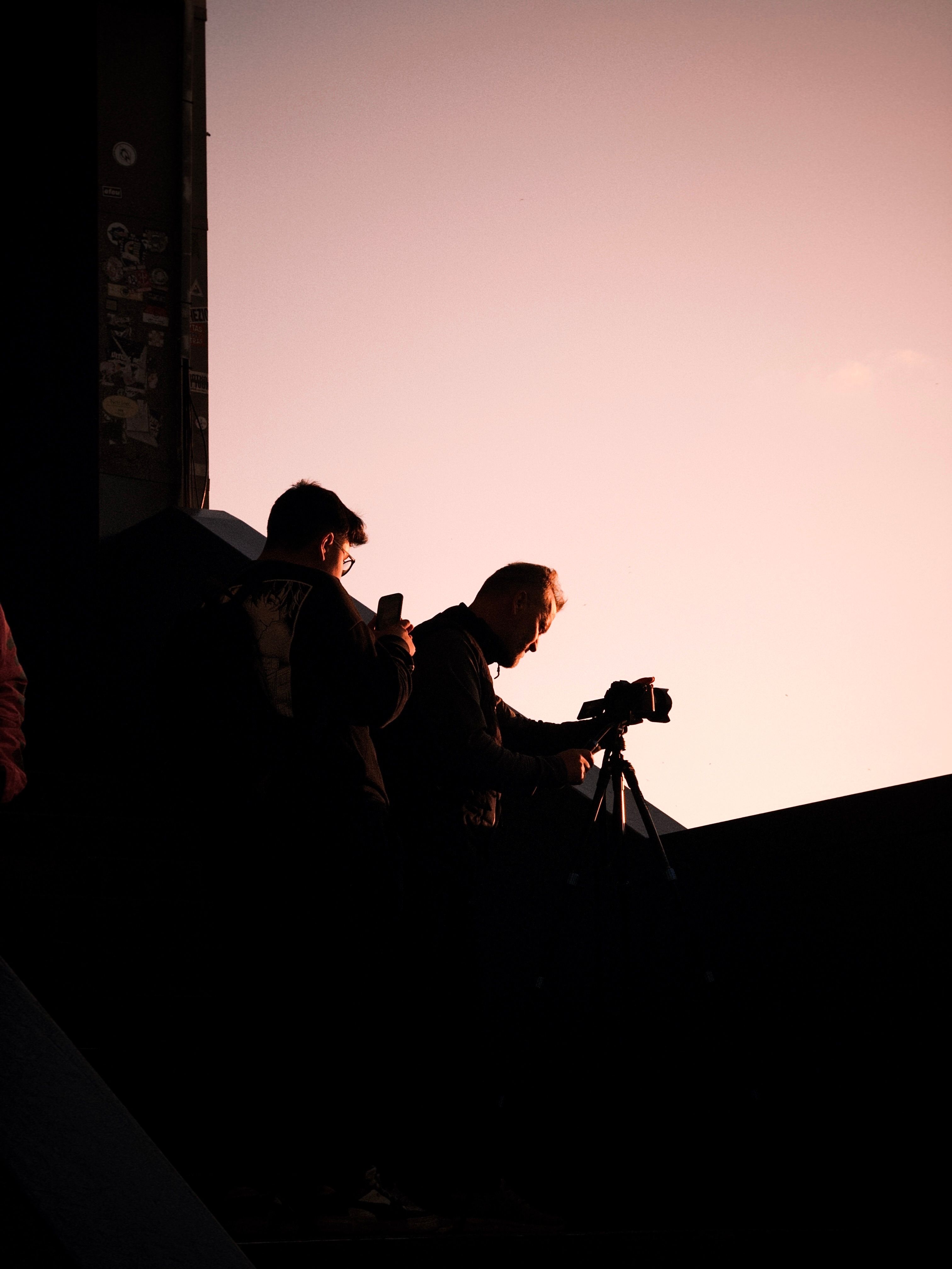Silhouette of Photographers at Sunset · Free Stock Photo
