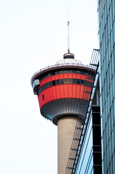 A striking view of the iconic Calgary Tower amidst the city's urban architecture.