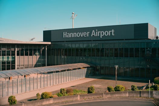 Hannover Airport building exterior on a clear day, showcasing modern architecture.