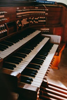 Close-up of a wooden church organ keyboard in Starogard Gdański, showcasing the intricate design.