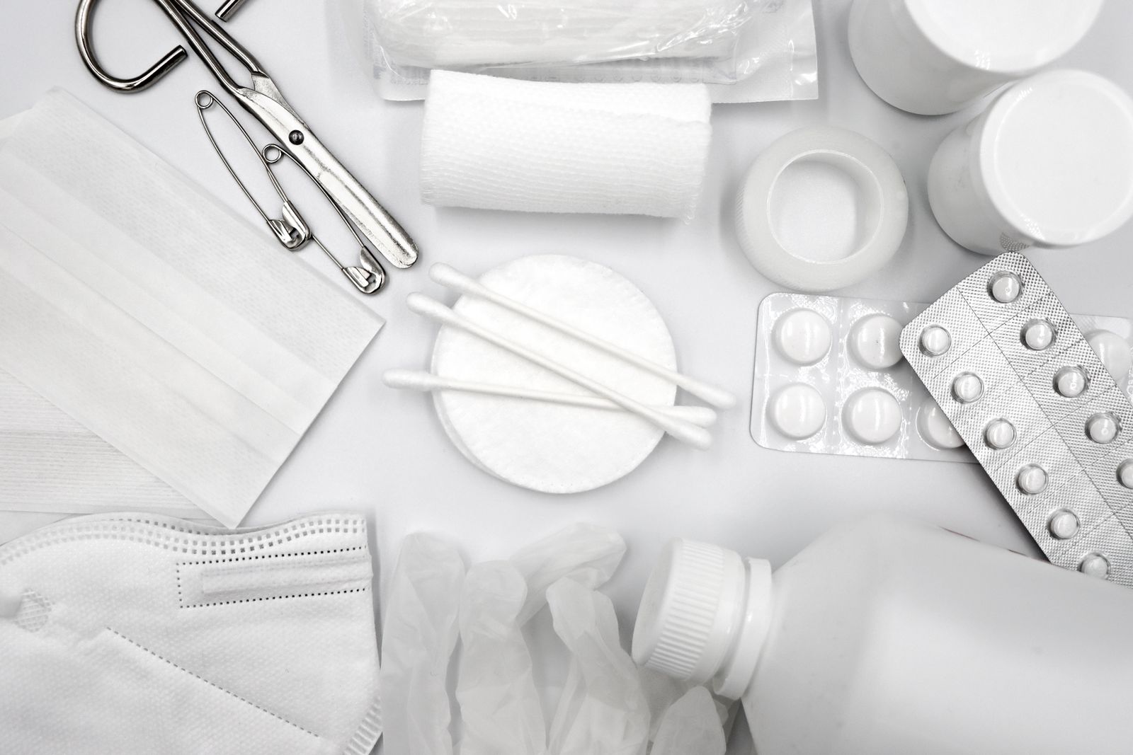 Bandages, gloves and practical first aid supplies arranged for organized home preparedness