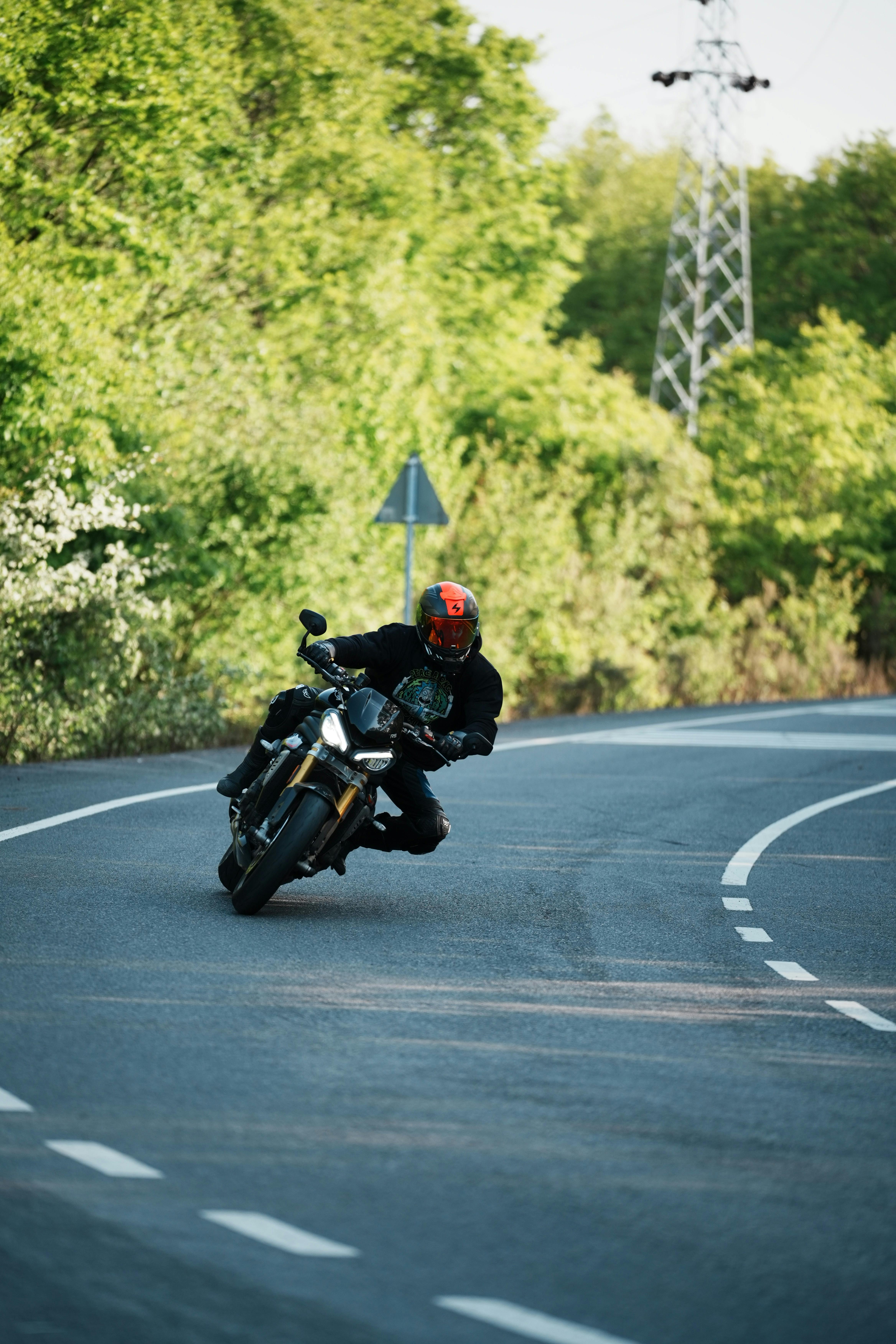 Motorcycle Racer Leaning in Countryside Road Curve · Free Stock Photo