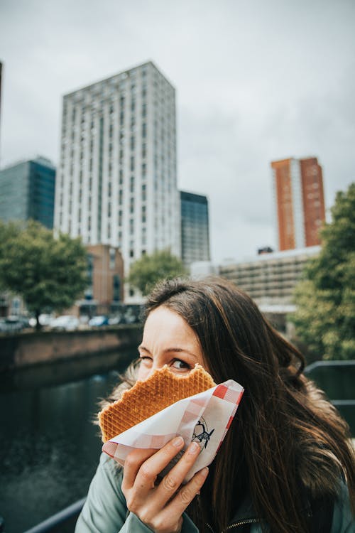 Woman Holding Baked Pastry