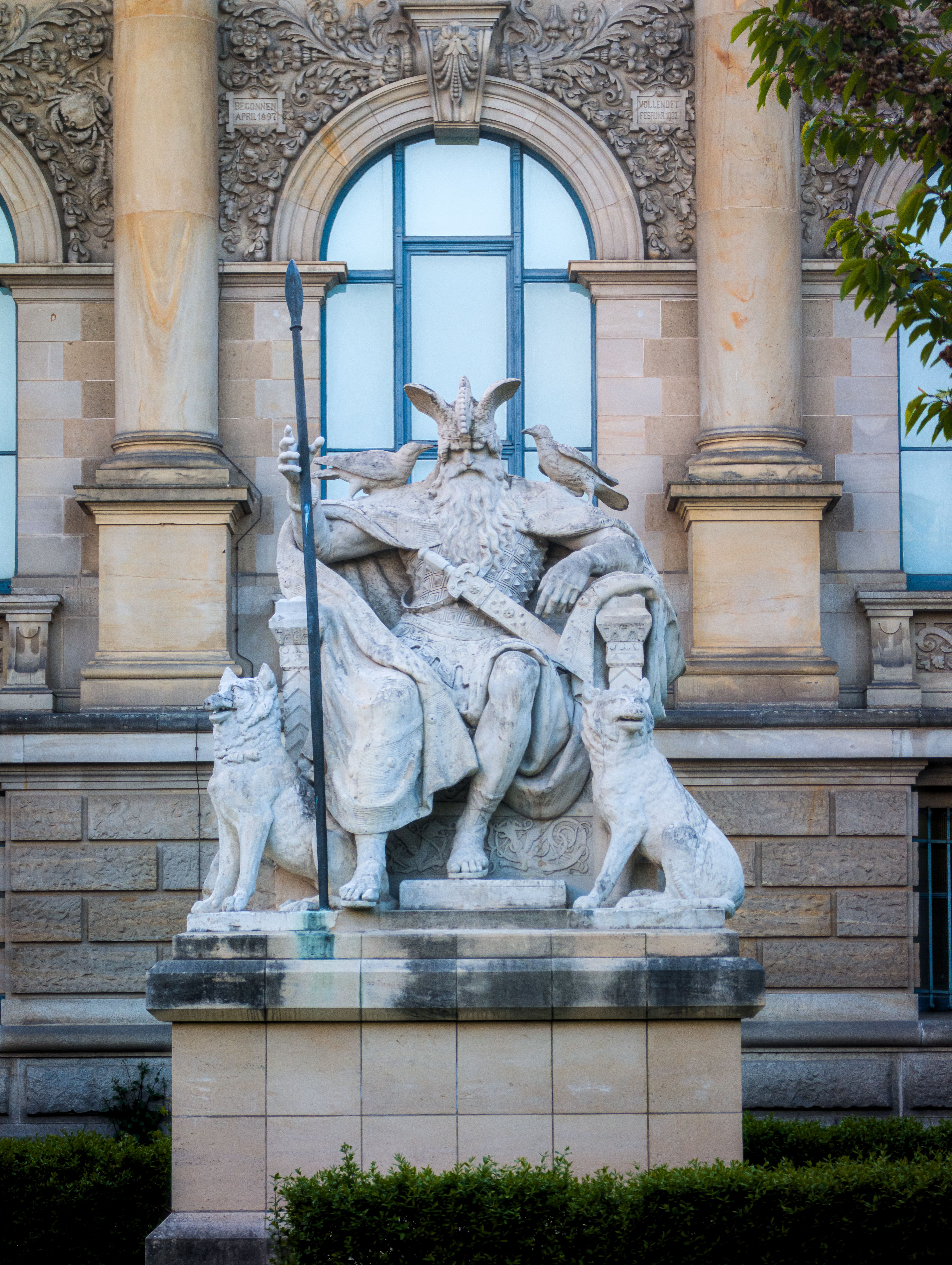 majestic stone statue of norse god odin outdoors
