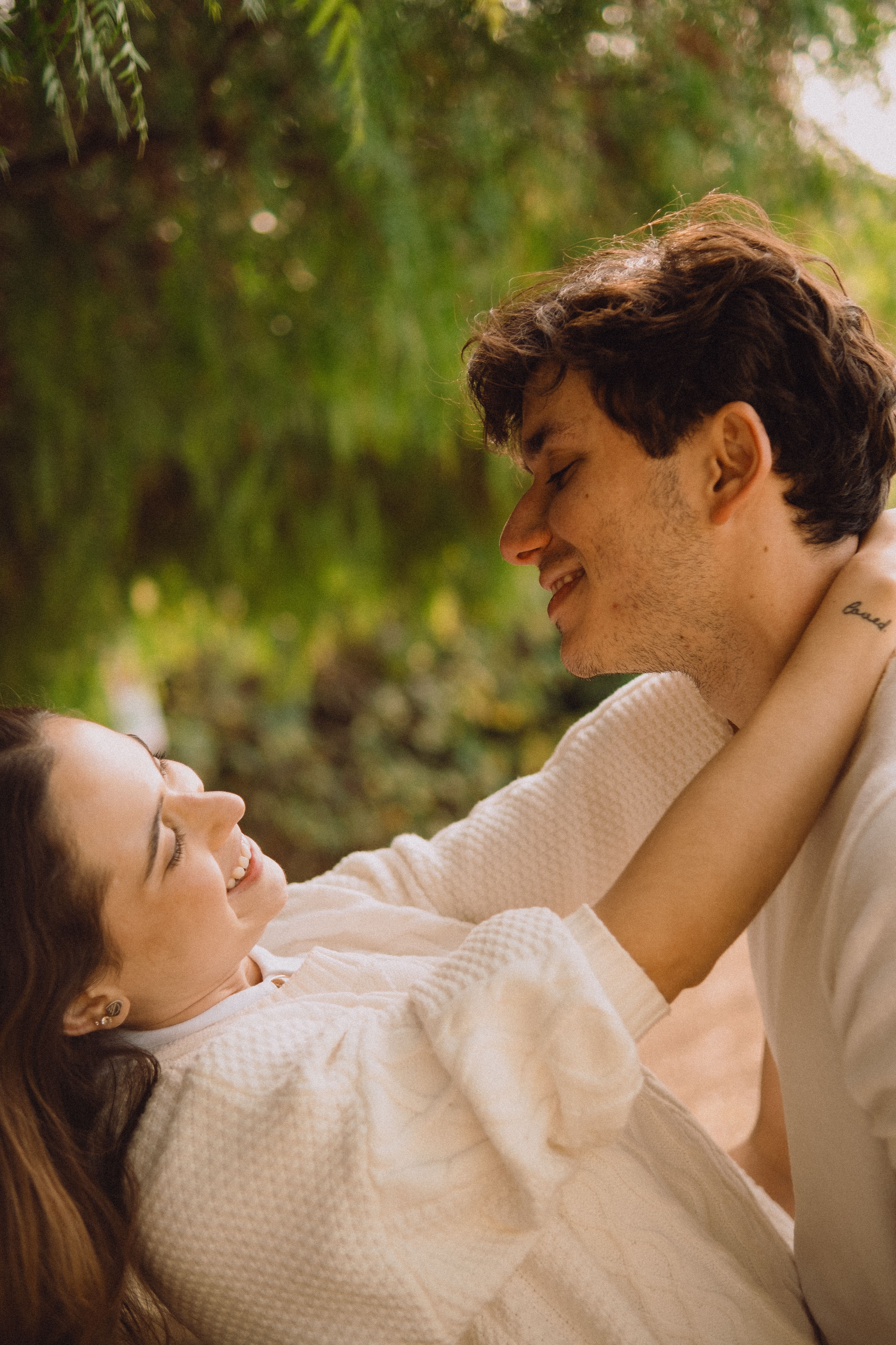 Romantic Couple Embracing Under a Tree in Los Angeles · Free Stock Photo