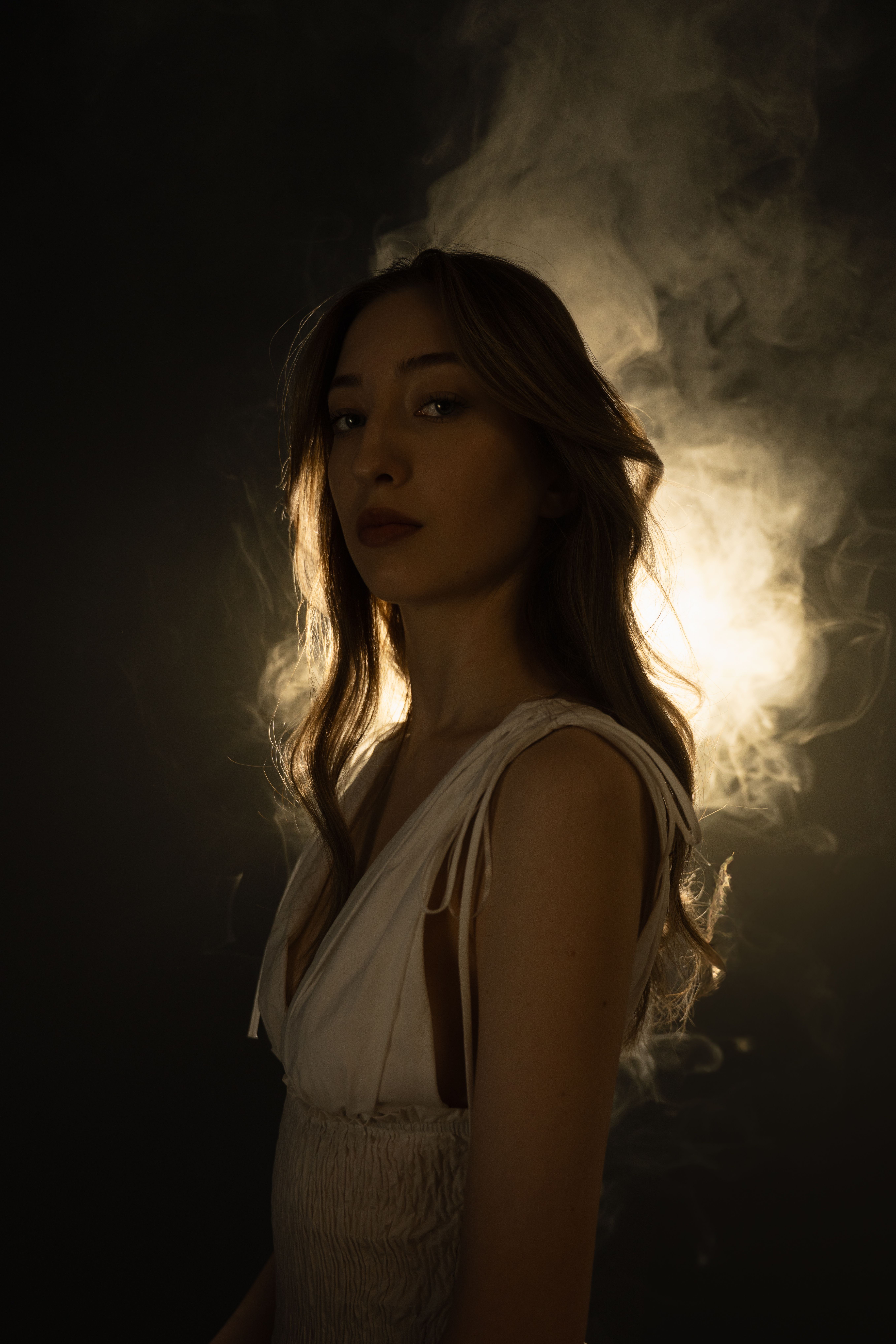 Moody Portrait of Woman with Dramatic Lighting · Free Stock Photo