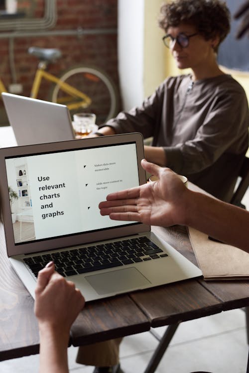 Free Photo Of Laptop On Top Of Wooden Table Stock Photo