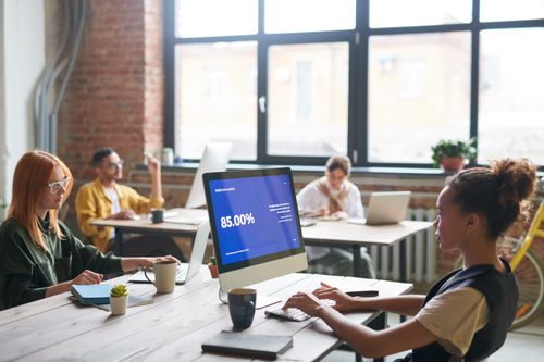 Free Coworking space with diverse team collaborating on technology projects, creating a dynamic work environment. Stock Photo