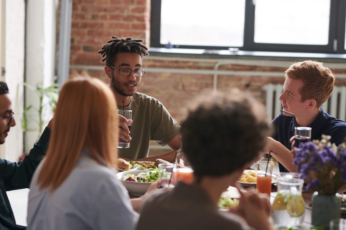 Free Group of Person Eating Indoors Stock Photo