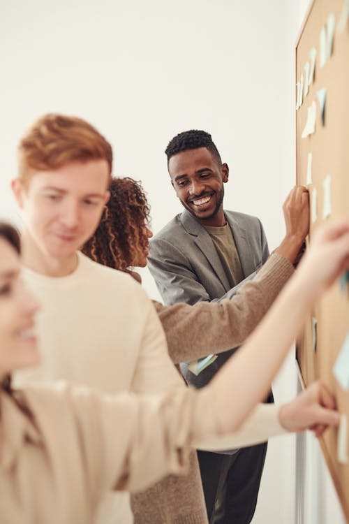 Free Group of People Standing Indoors Stock Photo