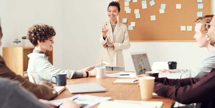 Business team brainstorming and discussing ideas in a modern office setting.