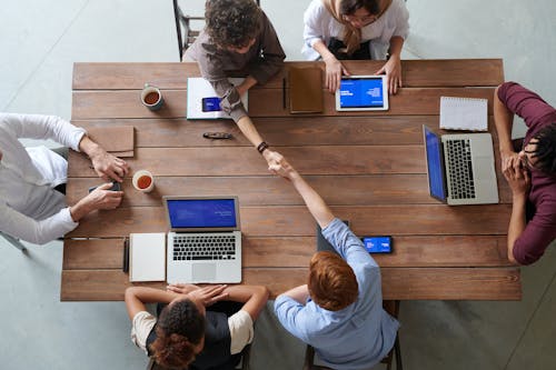 Free Group of Person Sitting Indoors Stock Photo