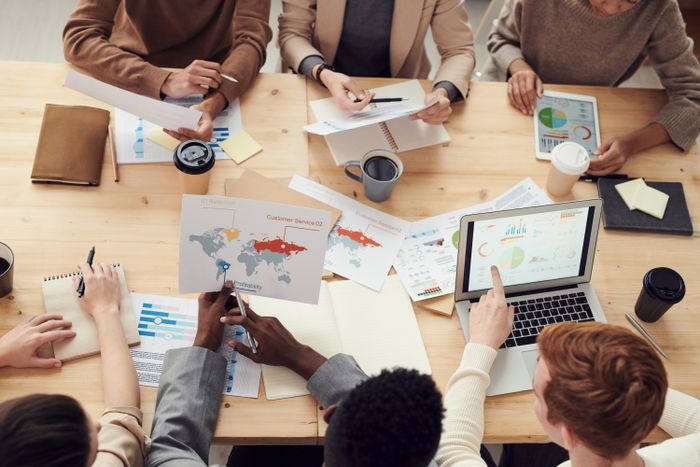 Team reviewing marketing charts in a collaborative meeting
