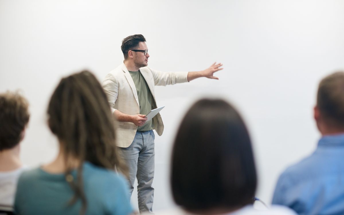 Trainee taking notes during a course