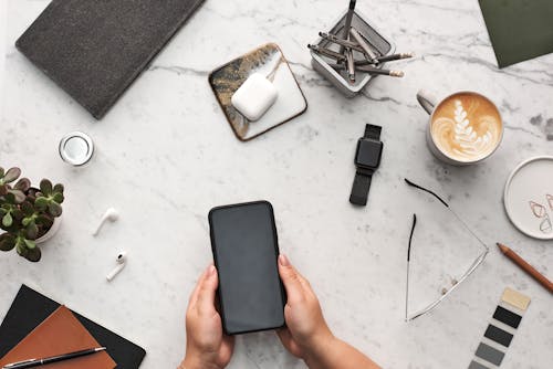 Person Holding Black Smartphone