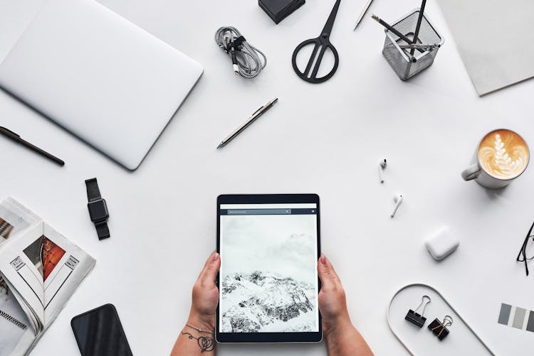 Person Holding Black Ipad