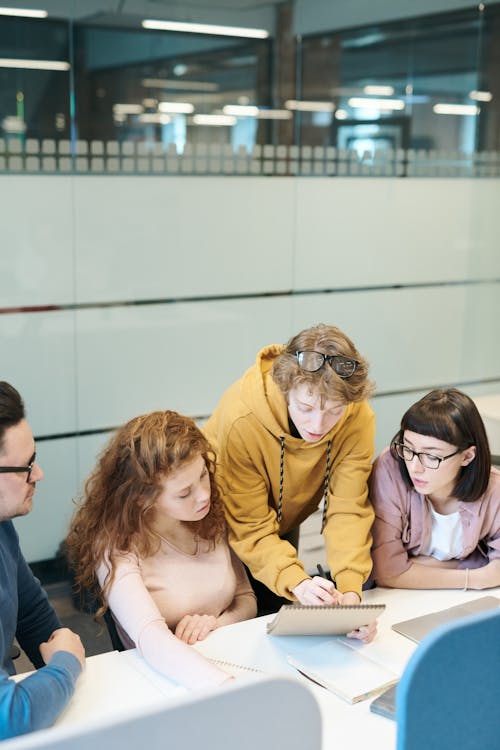 Free Group of People Sitting Indoors Stock Photo