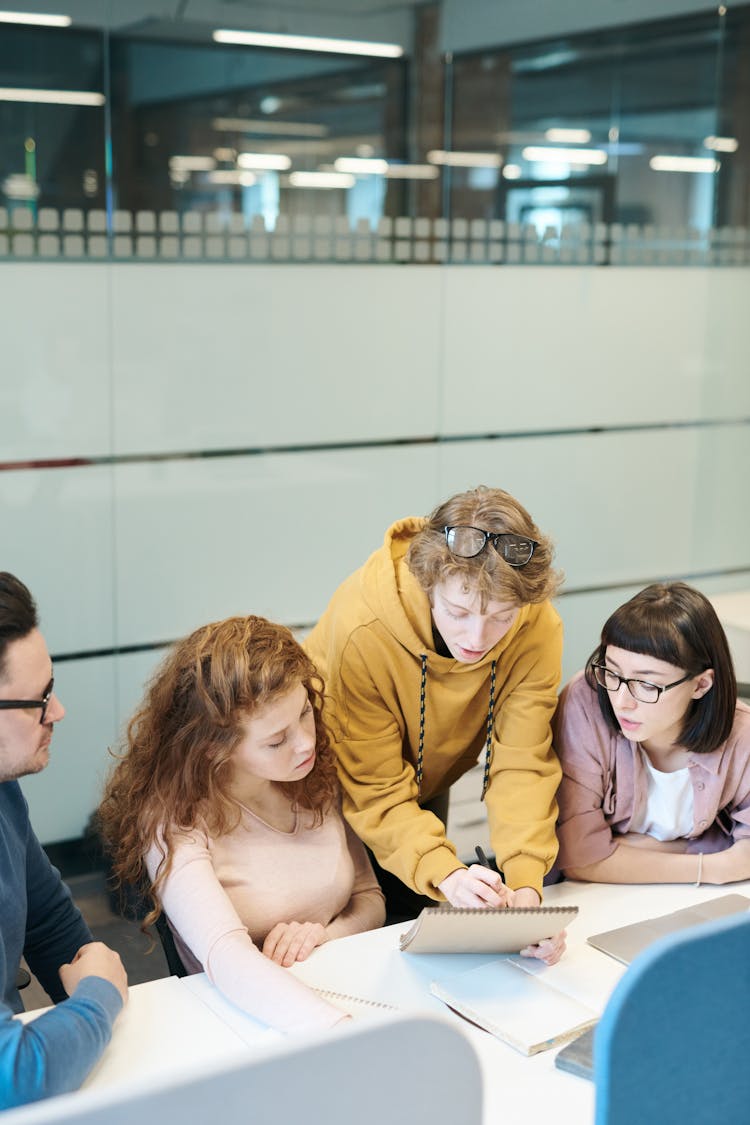 Group Of People Sitting Indoors