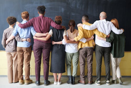 Free Group of People Standing Indoors Stock Photo