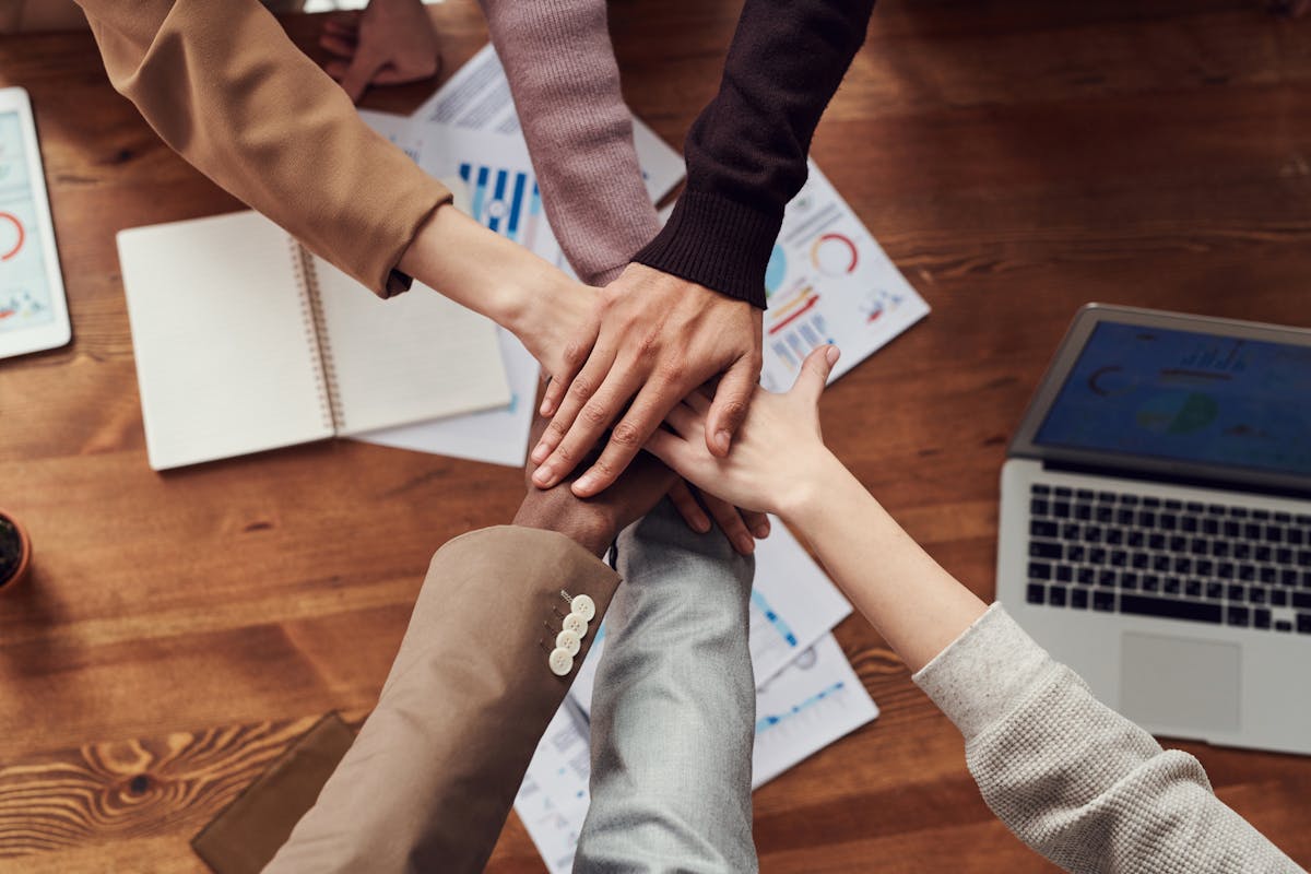 A team planning a workflow on a glass board