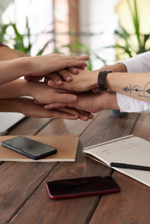 Free Photo Of People Near Wooden Table Stock Photo