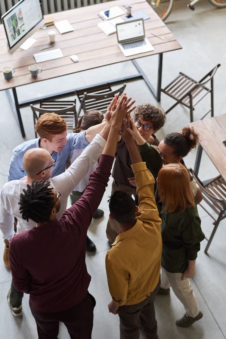 Photo Of People Holding Each Other's Hands