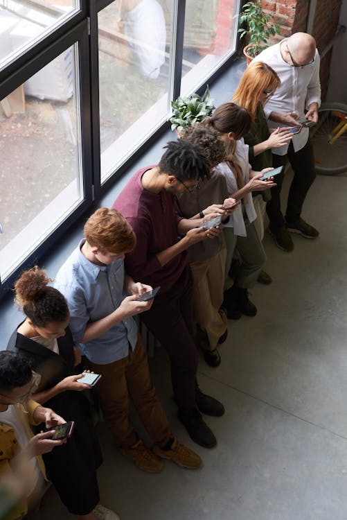 People Holding Their Phones