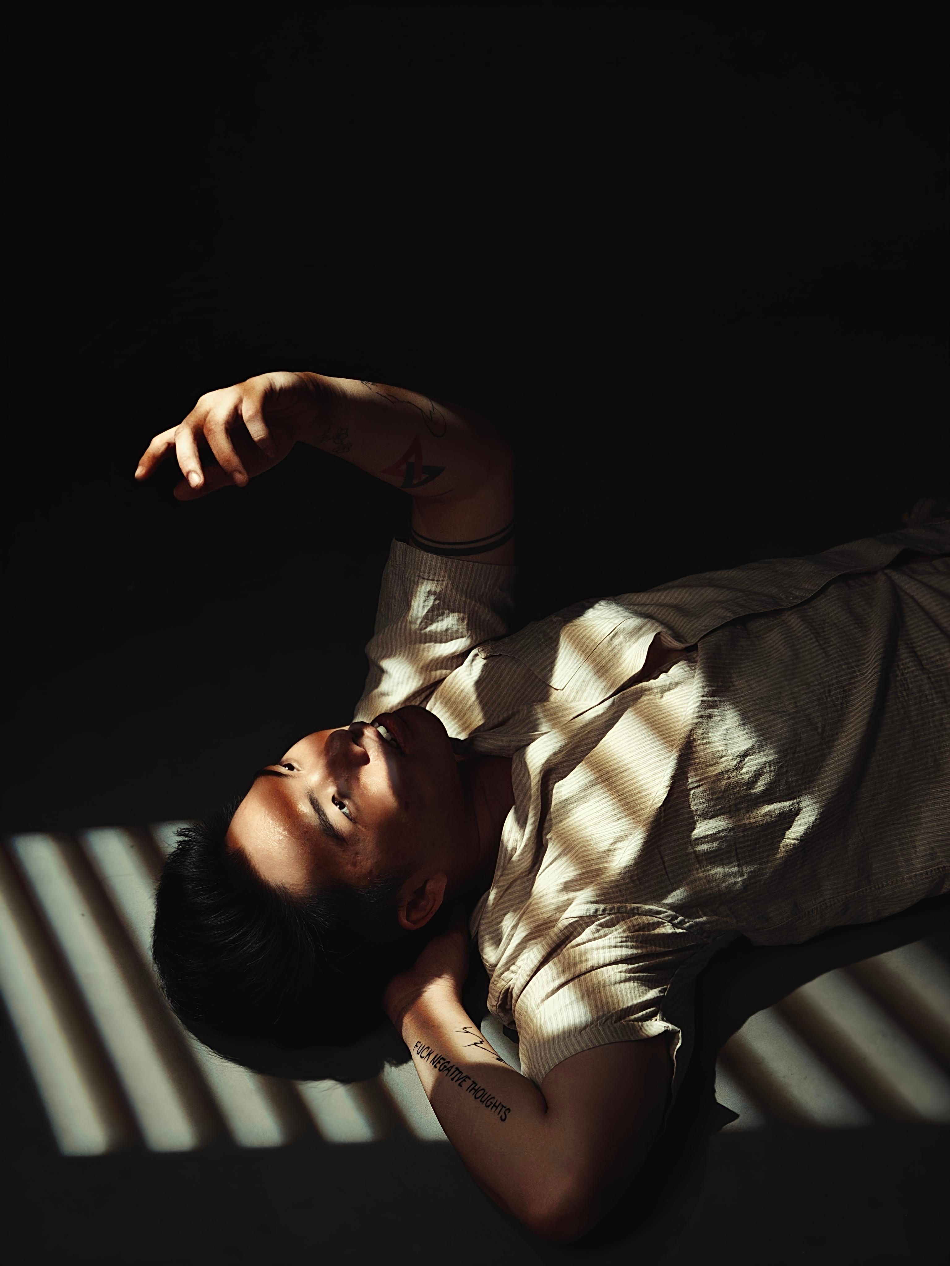 Dramatic Portrait of Person in Shadow and Light · Free Stock Photo