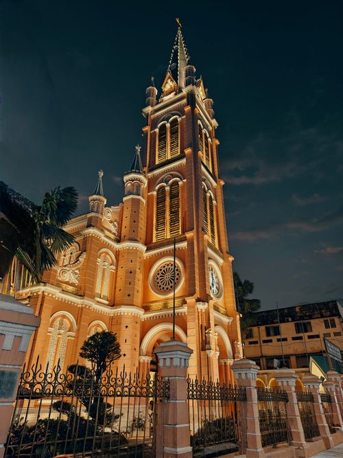 Free Stunning view of a gothic cathedral, beautifully lit against the night sky. Stock Photo