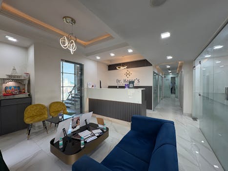 Elegant clinic reception area with sleek design and modern furnishings, located in New Delhi.