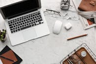 Flatlay Display of Electronics next to Eyeglases