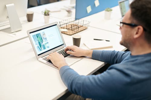 Free Man in front of his Laptop Stock Photo
