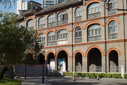 Free A historic building in Shanghai with an arched brick facade, typical of traditional Chinese architecture. Stock Photo