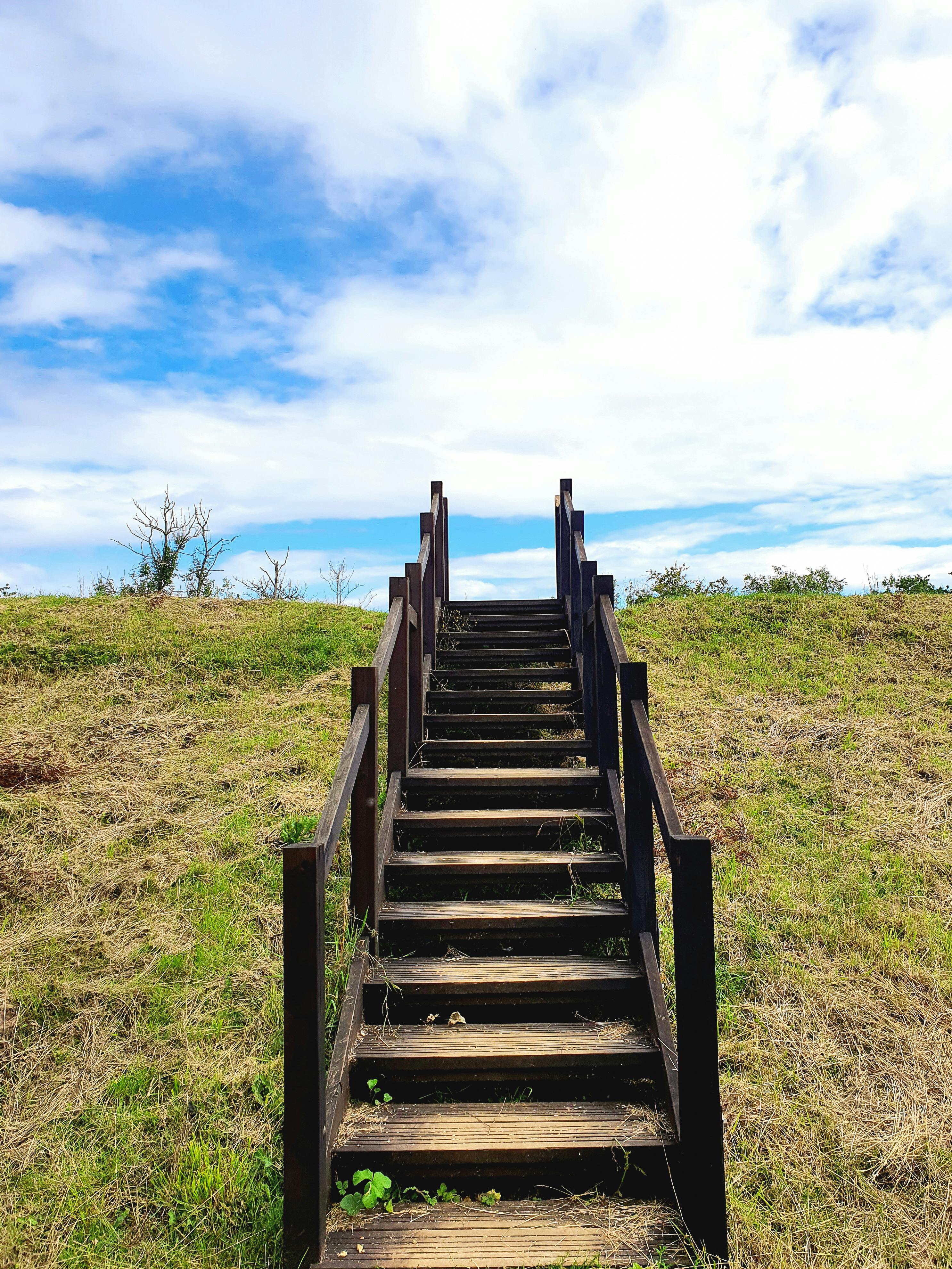Wooden staircase leading to a blue sky - metaphor for the steps to making your film.