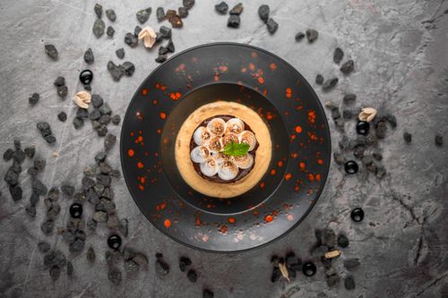 Free Elegant modern dessert arrangement with creative food styling on a textured surface. Stock Photo