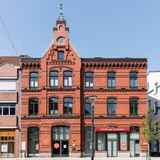 Red brick civic building facade, photo by Wolfgang Weiser on Pexels