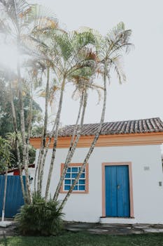 Colonial-style house with palm trees in Porto Seguro, Bahia, Brazil.