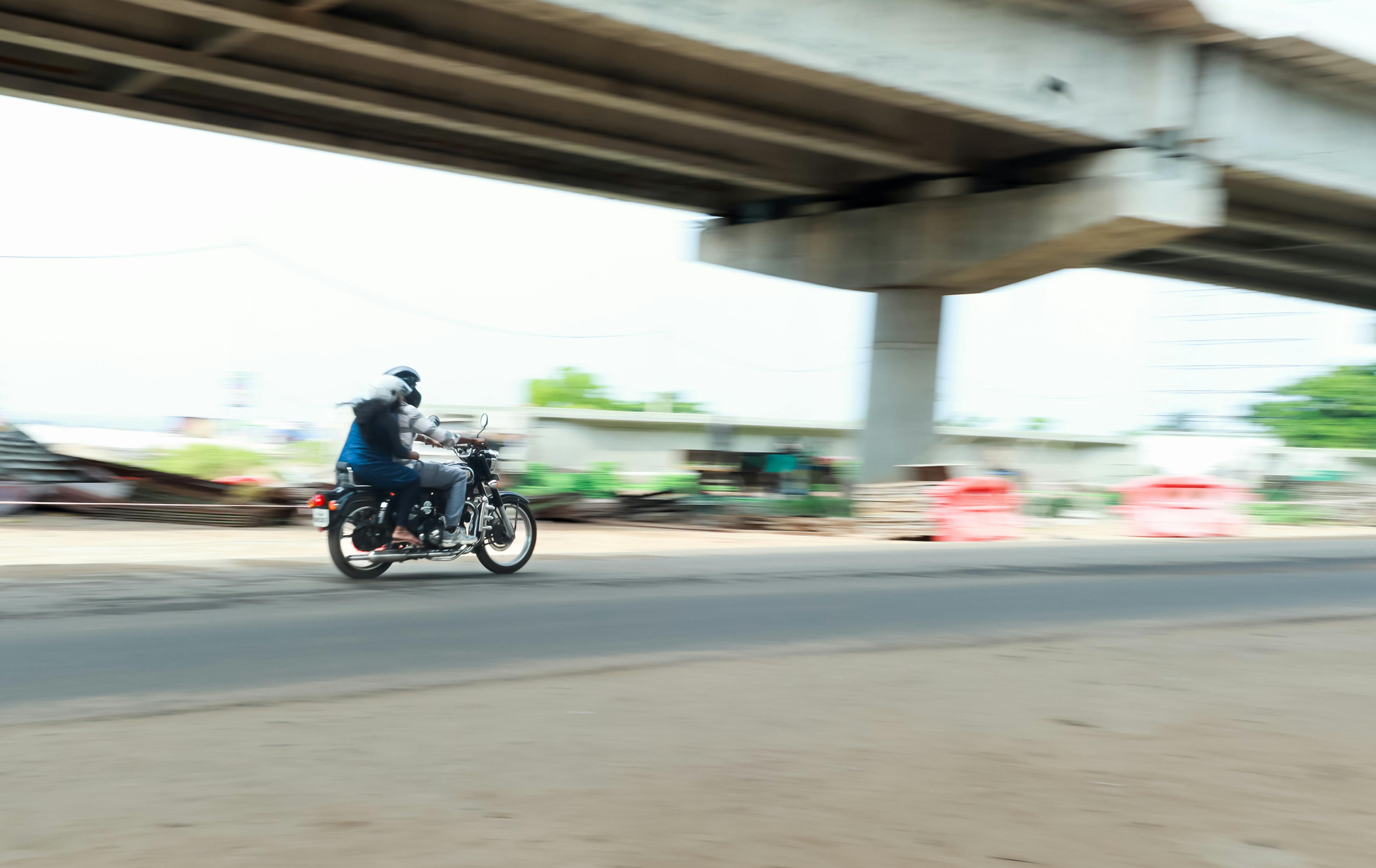 Blurred motion of pedestrians and vehicles, creating mood in a street scene
