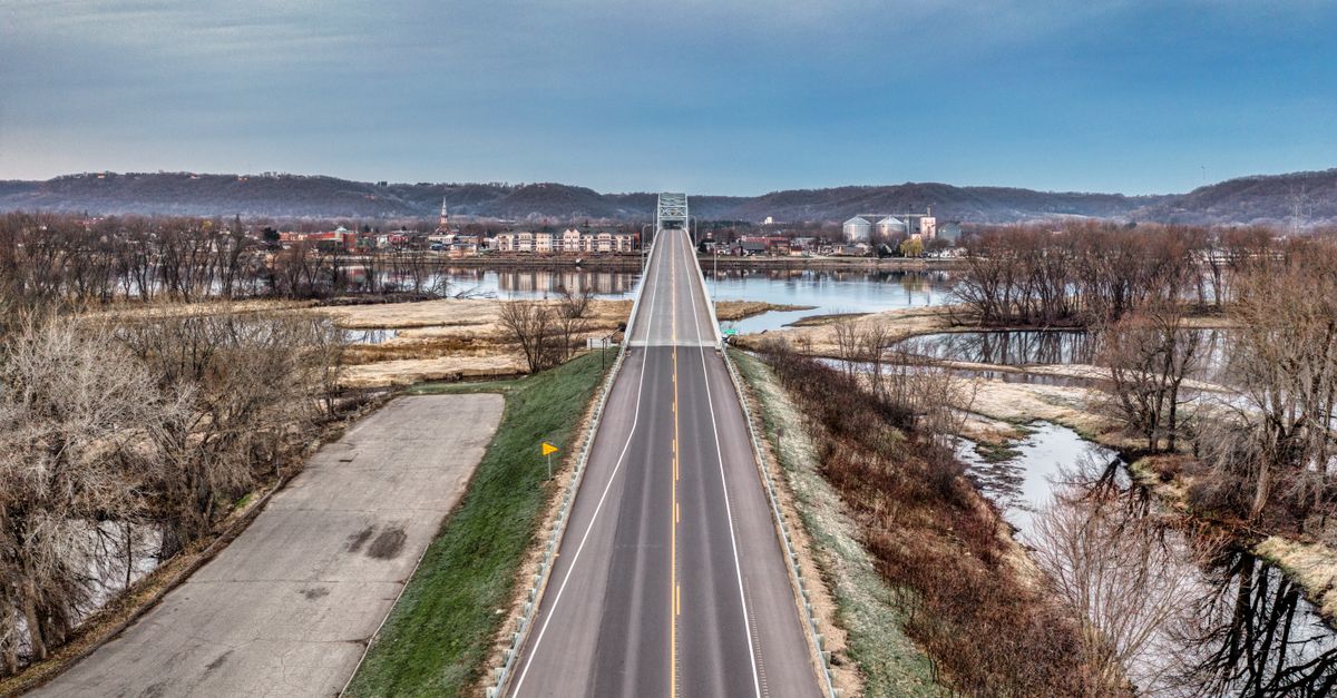 A scenic aerial view of a bridge over the Mississippi River in Wabasha, Minnesota, during winter.