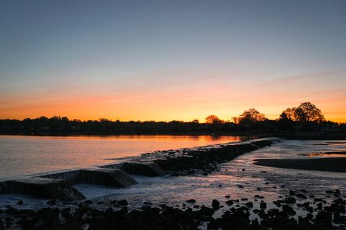 Free Capture the tranquil beauty of a sunrise over waterfalls at Cove Island Park, Stamford, Connecticut. Stock Photo