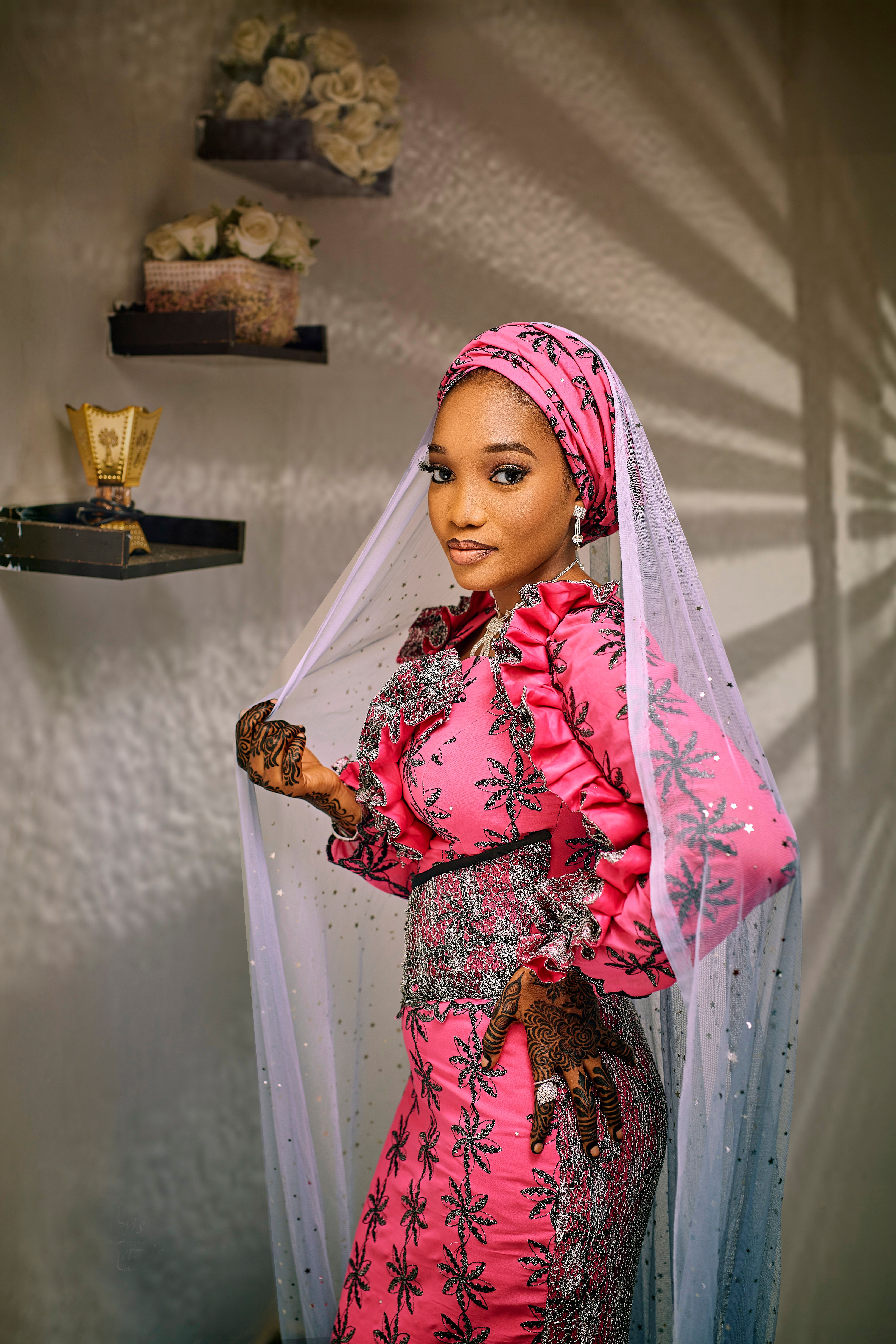 Elegant Woman in Traditional Pink Attire Indoors · Free Stock Photo