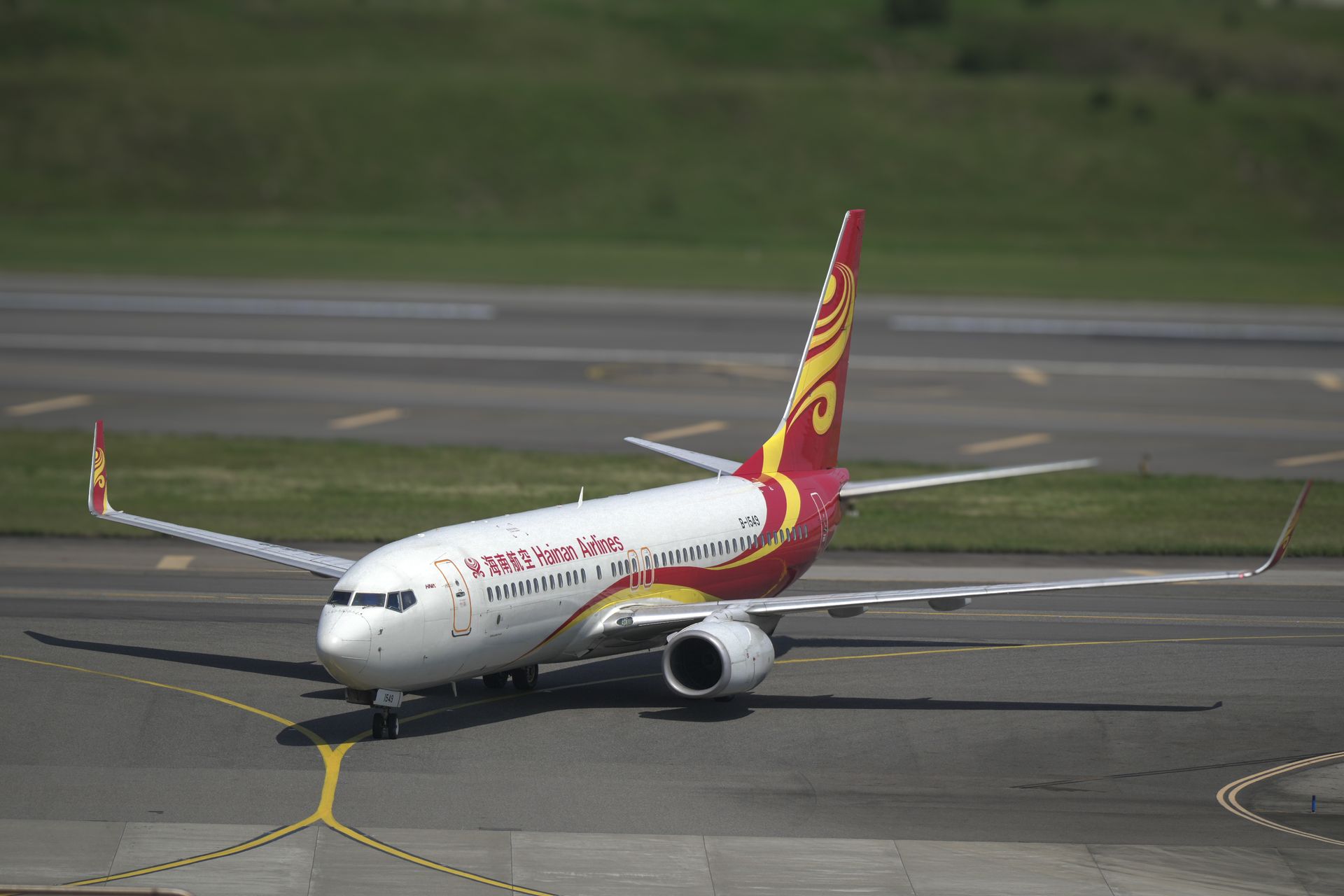 Hainan Airlines Boeing 737 taxiing on the runway at Taoyuan City Airport, Taiwan.