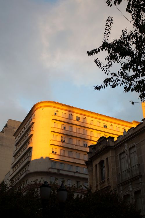 Free Golden sunset light casts on historic buildings in Curitiba, Paraná, Brazil. Stock Photo