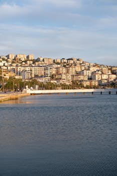 Picturesque view of Istanbul's waterfront with modern apartments at sunset, showcasing urban life.
