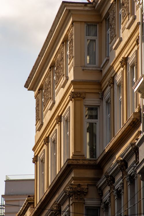 Free Elegant facade of a classic Istanbul building with detailed ornamentation in warm sunlight. Stock Photo