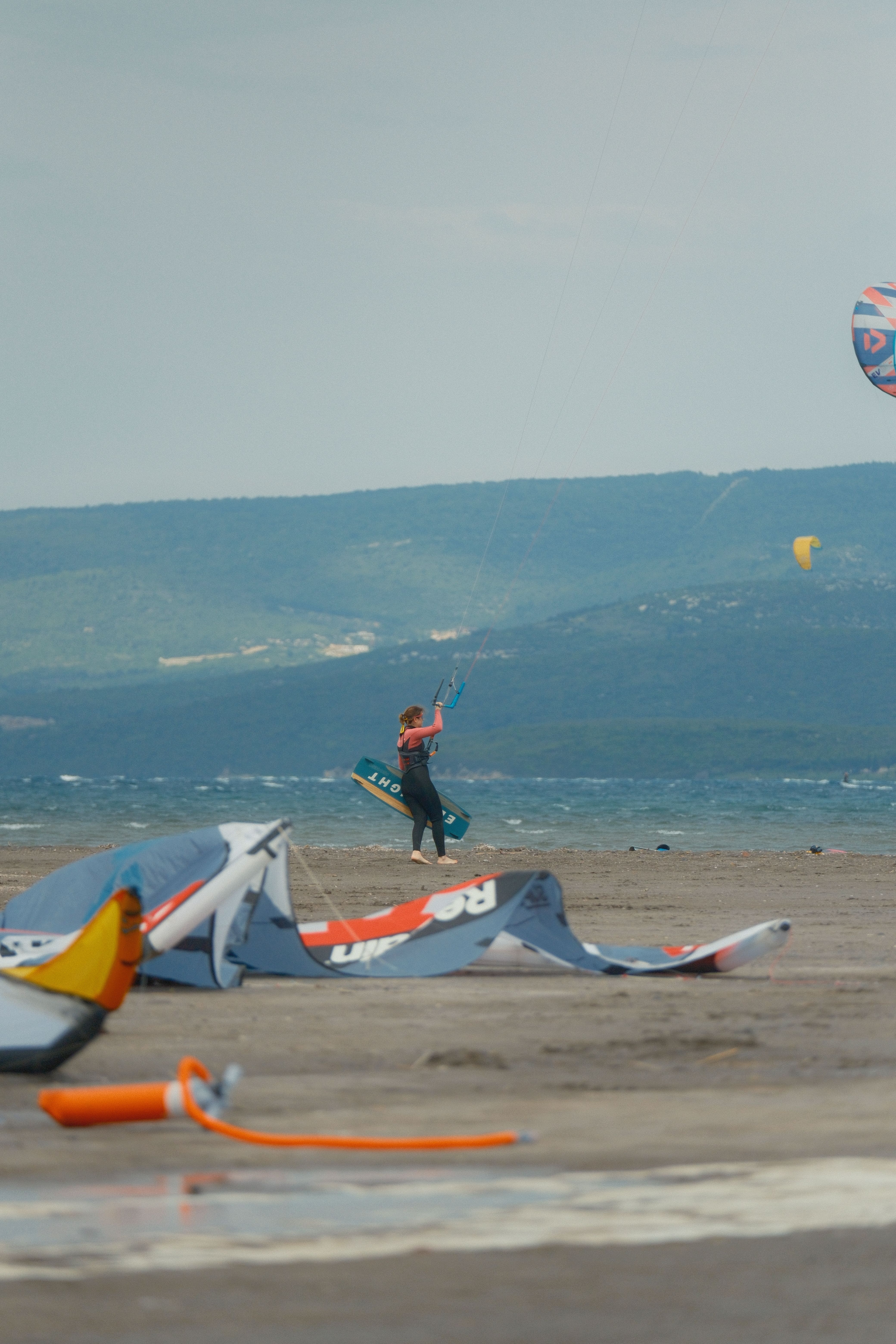 Kitesurfer Enjoying a Breezy Day at the Beach · Free Stock Photo