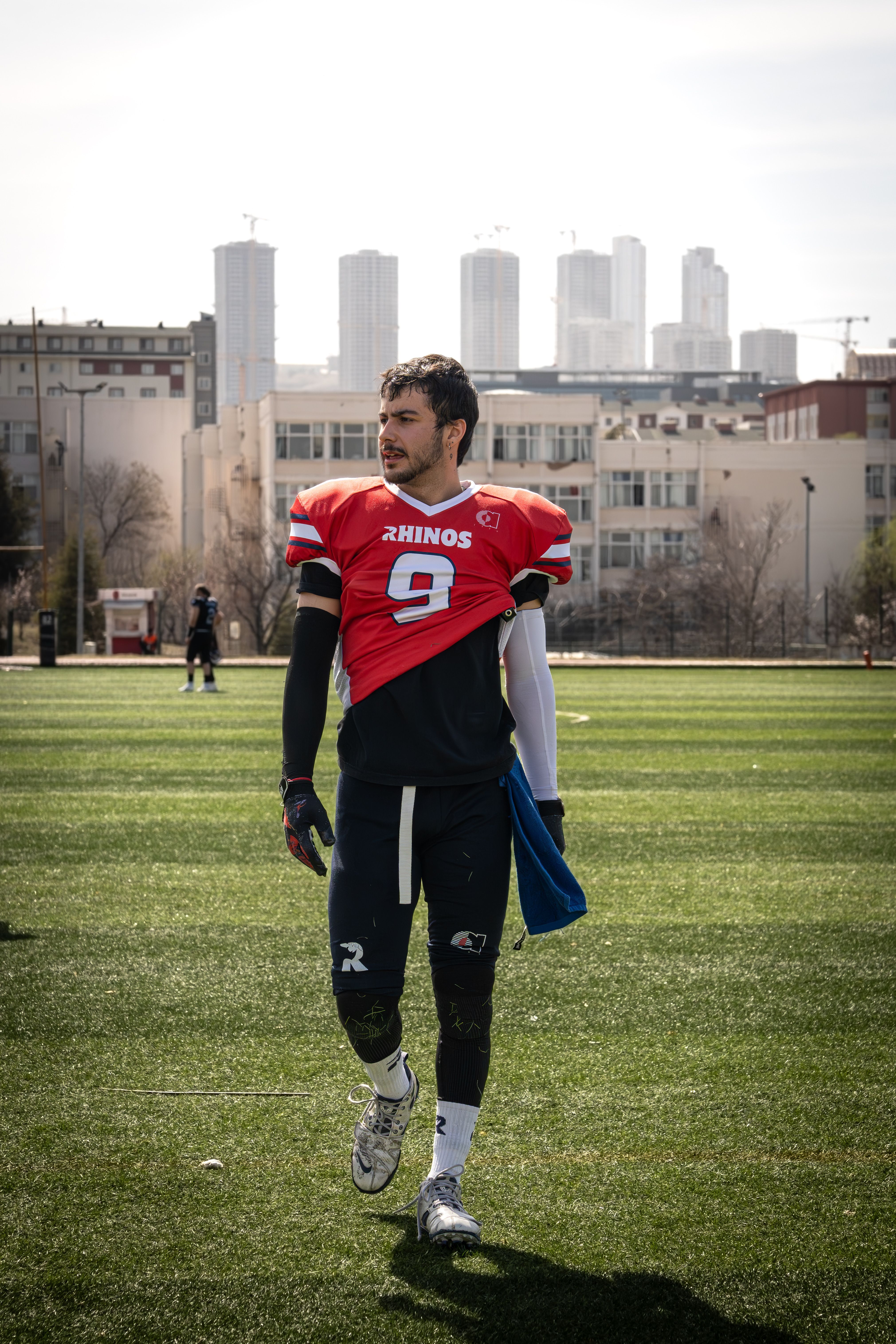 Confident Football Player on Urban Field · Free Stock Photo