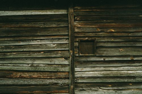 Free Close-up of a rustic wooden cabin wall in Poland showcasing weathered texture. Stock Photo
