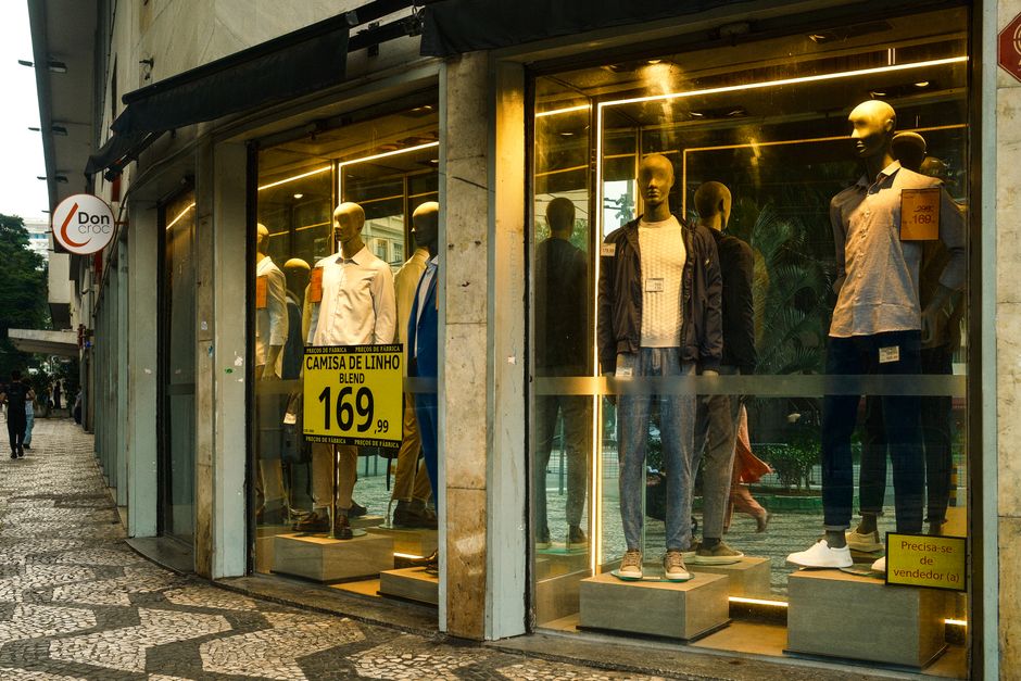 Stylish men's fashion display in a São Paulo storefront with mannequins showcasing modern apparel. Stylish men's fashion display in a São Paulo storefront with mannequins showcasing modern apparel.