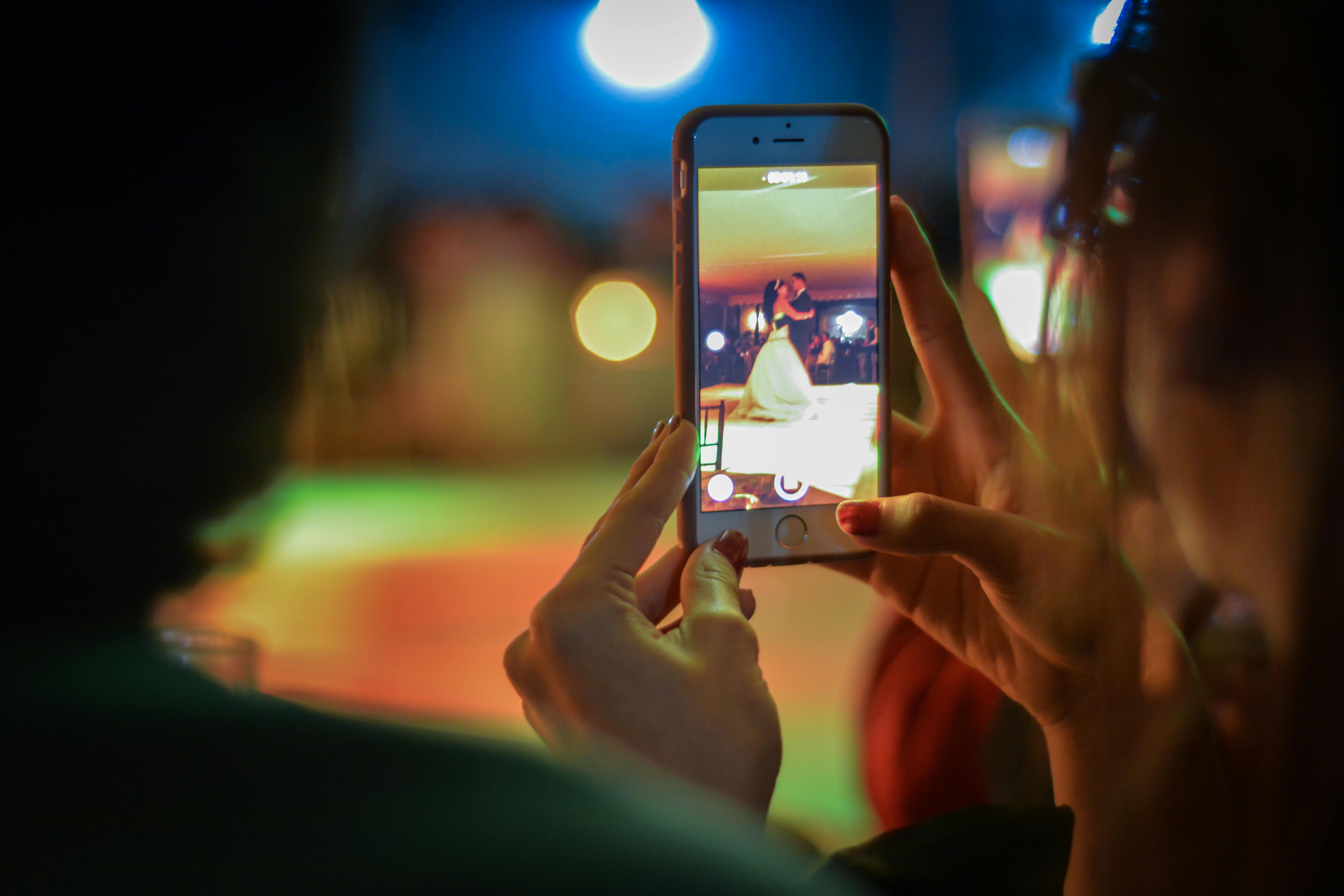 close up of woman using mobile phone at night